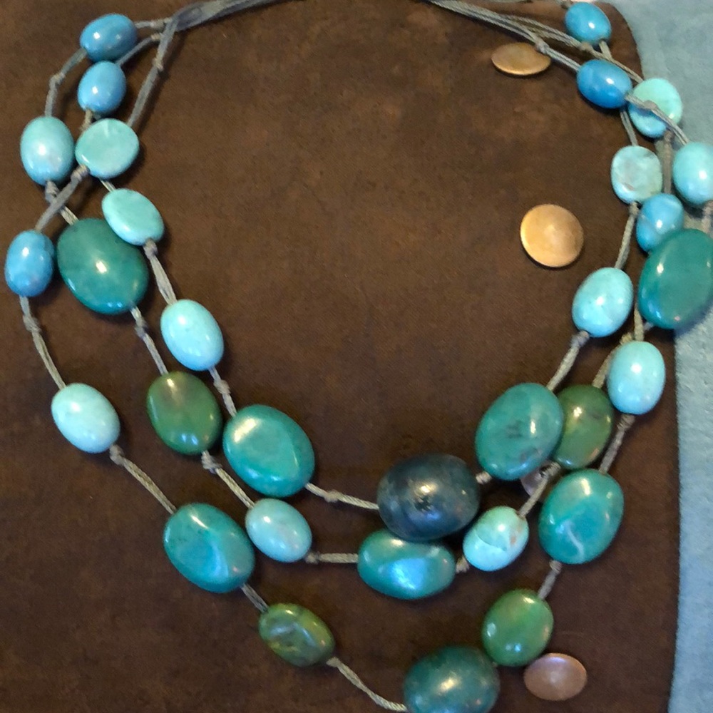 Three strand turquoise colored necklace